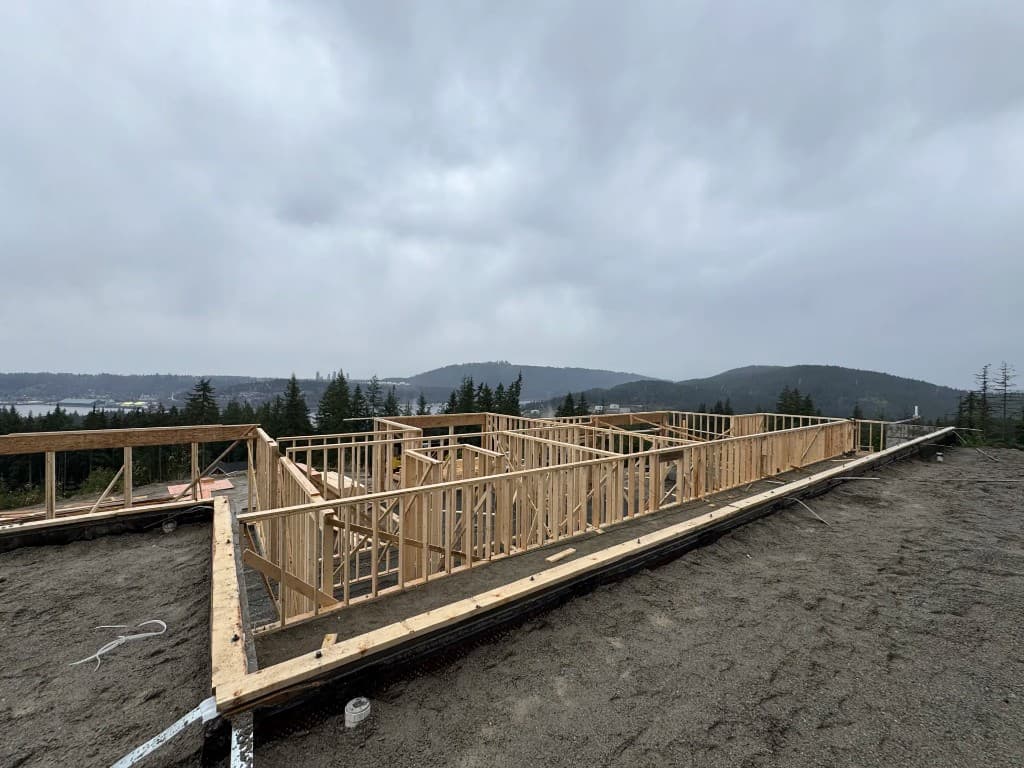 Residential wood framing on a hilltop with scenic view