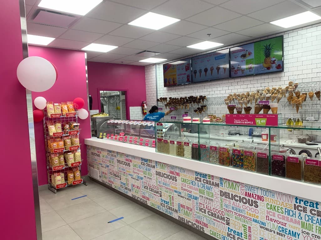 Marble Slab Creamery restaurant interior with service counter, digital menu boards, and branded finishes